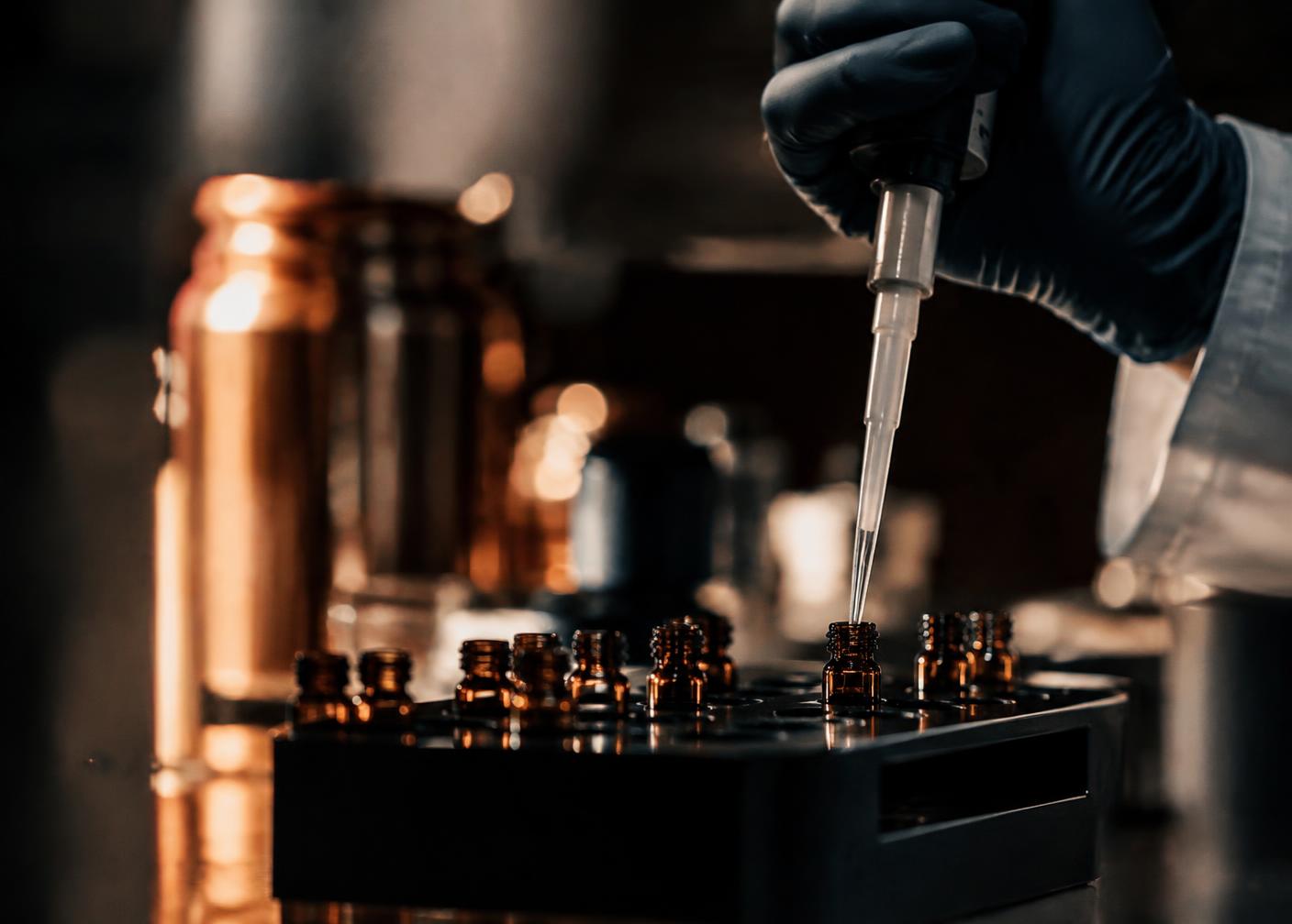 Pharmacist compounding into amber vials